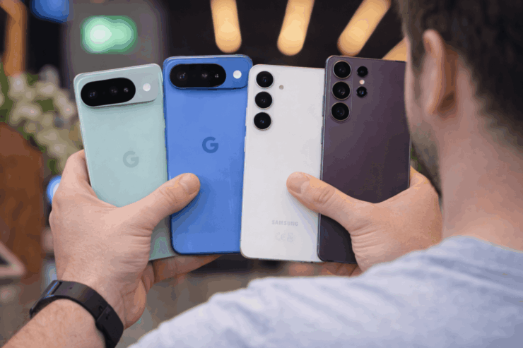 Holding four smartphones in hand