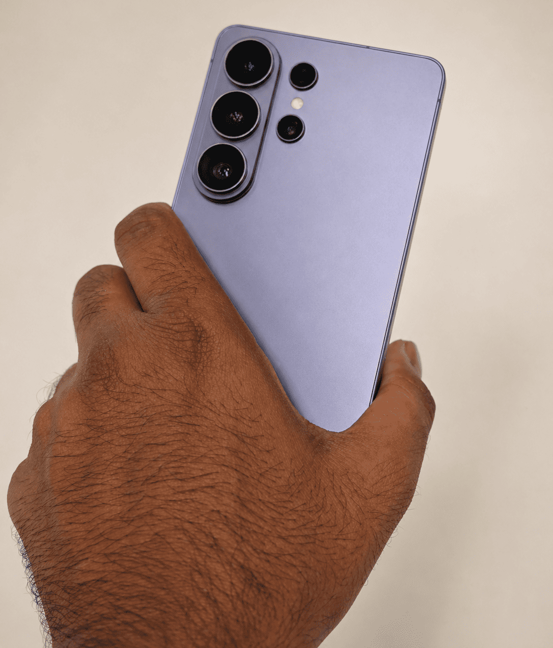 Man holding S26 Ultra with a back showing camera set up (1)