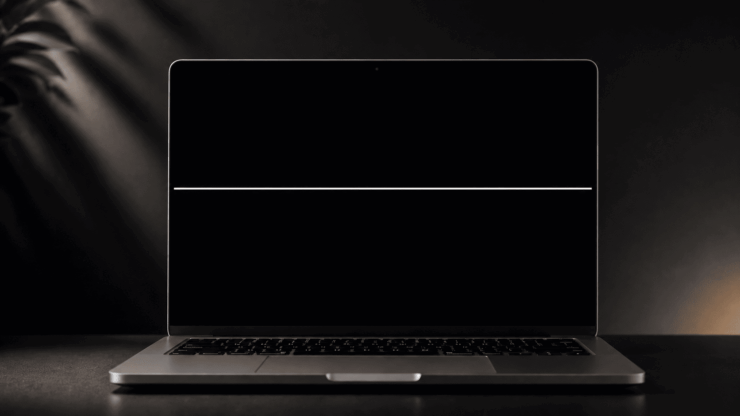 Minimalist laptop with soft lighting with a white line on the Mac screen