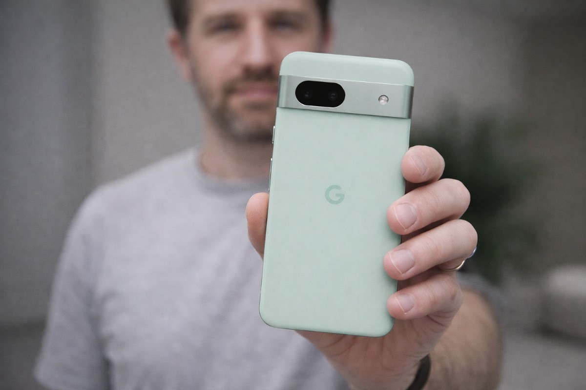 Mint green Google Pixel in hand 