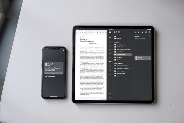 Google Pixel 10 phone and a Pixel Tablet side by side on a light grey concrete surface,