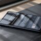 Google Pixel 10 Pro resting on a matte dark slate surface at a 45-degree angle